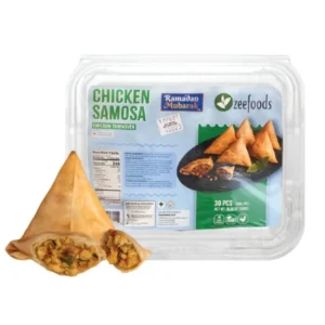 Packaged chicken samosas with one samosa beside the pack.