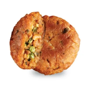 Two golden-brown Indian aloo tikki with peas and spices inside.