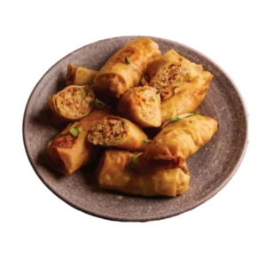 Plate of golden, crispy spring rolls filled with vegetables.
