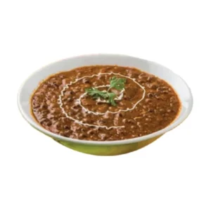 A bowl of creamy dal makhani garnished with cream and coriander.