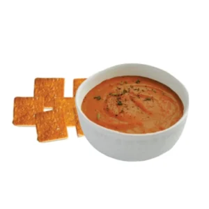 Creamy tomato soup served with toasted bread.