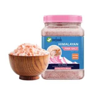 Pink Himalayan salt in a wooden bowl and a plastic container.