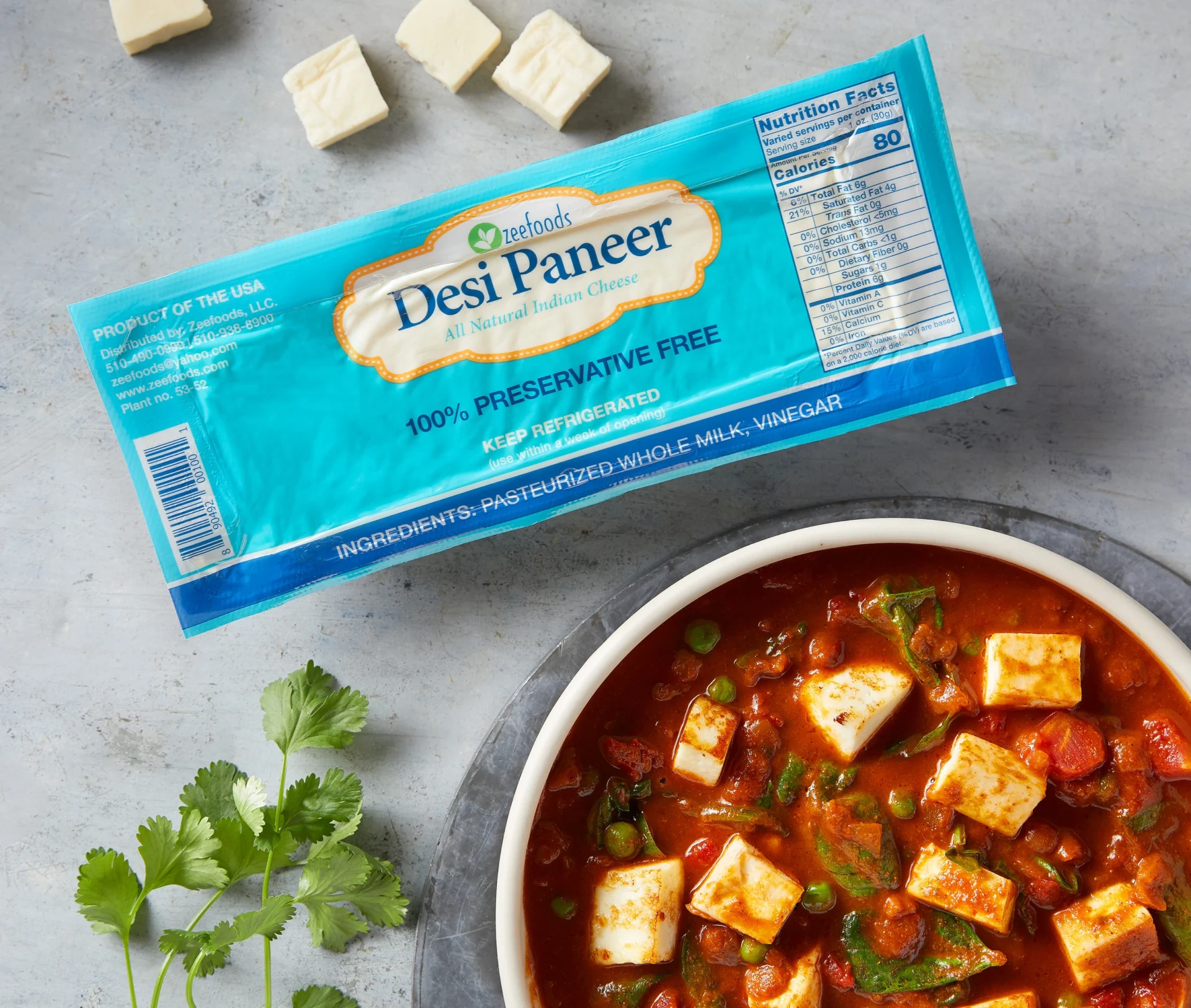 Paneer cubes ready to cook with Desi Paneer packaging.