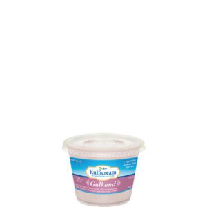 Small container of Philadelphia cream cheese, chive flavor.
